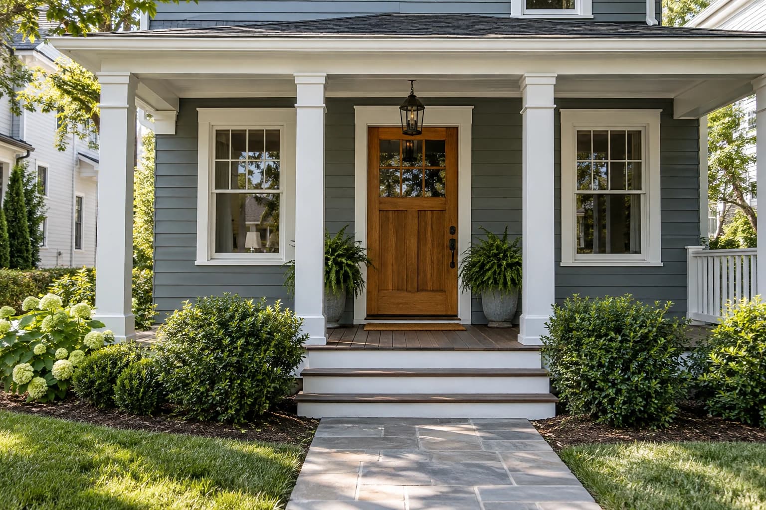 Traditional front porch showing siding, windows and a clear approach